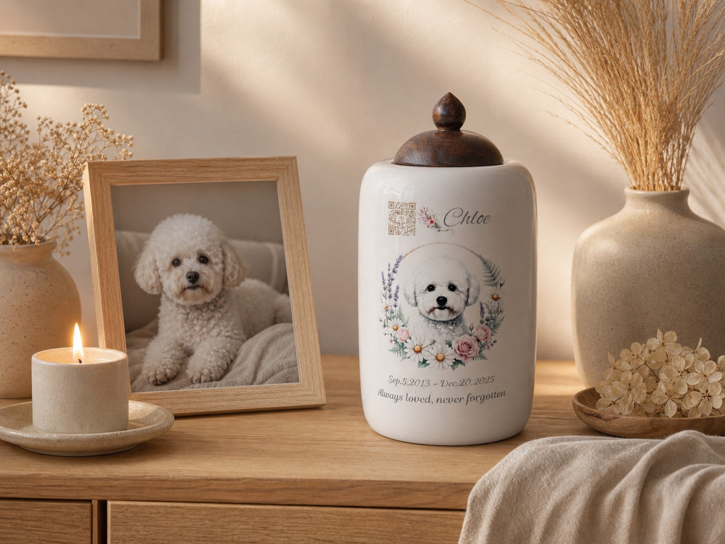 A personalized pet urn placed in a warm home memorial setting with candle and framed photo